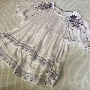 Floral embroidered lightly sheer hi low white oversize top with shimmer floral